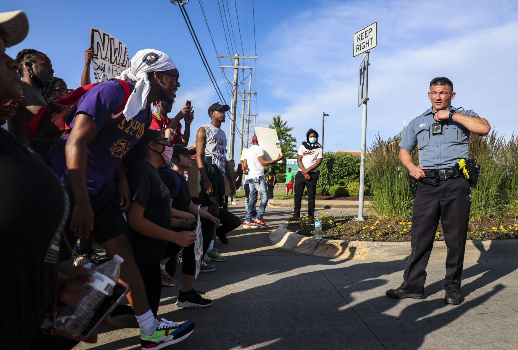 Protesters march down Highway 67
